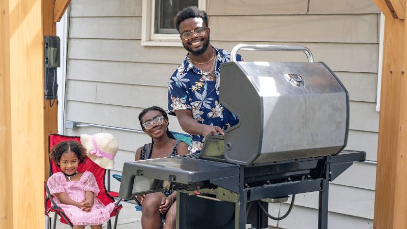 Family grilling on the patio.