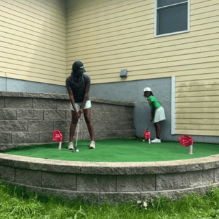 Homeowner on her putting green.